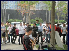 Pop rock band performing in Futian, near Civic Center.